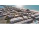 High aerial view of a neighborhood by the beach, highlighting the coastal community and proximity to the ocean at 111 6Th N St, Bradenton Beach, FL 34217