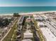 Aerial view of beachfront property with rooftop deck and inviting pool at 111 6Th N St, Bradenton Beach, FL 34217