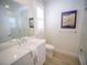 Bright bathroom with a glass-enclosed shower and 'Ocean Pearl Coral Reef' sign at 111 6Th N St, Bradenton Beach, FL 34217