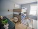 Cozy ' bedroom featuring bunk beds, a blue color scheme, and nautical decor at 111 6Th N St, Bradenton Beach, FL 34217
