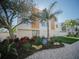 Beautiful coastal home featuring a landscaped front yard, modern design, and a welcoming beach vibe at 111 6Th N St, Bradenton Beach, FL 34217