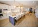 Modern kitchen with a large island, stylish lighting, and seating for eight at 111 6Th N St, Bradenton Beach, FL 34217