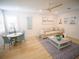 Inviting living room with a comfortable sofa, stylish decor, and a ceiling fan at 111 6Th N St, Bradenton Beach, FL 34217