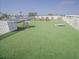 Spacious rooftop deck with artificial grass, seating, and games at 111 6Th N St, Bradenton Beach, FL 34217
