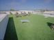 Spacious rooftop featuring comfortable seating, cornhole game, and stunning panoramic views at 111 6Th N St, Bradenton Beach, FL 34217