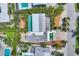 Stunning aerial view of a property featuring a pool, lush landscaping, and meticulous architectural design at 1168 Westway Dr, Sarasota, FL 34236