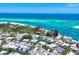 Wonderful aerial perspective shows this home near the beautiful beach coastline, with incredible ocean views at 1168 Westway Dr, Sarasota, FL 34236