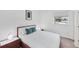 Cozy bedroom with a comfortable bed, modern nightstands, and natural light from the window at 1168 Westway Dr, Sarasota, FL 34236