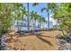 Gorgeous home surrounded by mature trees and lush landscaping creating a private oasis at 1168 Westway Dr, Sarasota, FL 34236