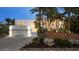 Beautiful home with lush landscaping and a well-lit garage and stairway leading to the entrance at 1168 Westway Dr, Sarasota, FL 34236