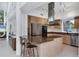 Modern kitchen with stainless steel appliances and a center island and breakfast bar at 1168 Westway Dr, Sarasota, FL 34236