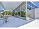 Stylish patio with seating and views of the pool, landscape, and interior living spaces at 1168 Westway Dr, Sarasota, FL 34236