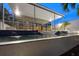 Night shot of a swimming pool with water features illuminated by exterior lighting and modern architectural design at 1168 Westway Dr, Sarasota, FL 34236