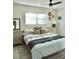 Bright bedroom featuring a comfortable queen bed, two dressers and a stylish mirror creating a warm place to rest at 1207 65Th Nw St, Bradenton, FL 34209