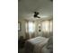 Bright bedroom featuring a comfortable bed, large windows and warm decor, creating a serene place to rest at 1207 65Th Nw St, Bradenton, FL 34209
