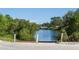 View of a boat ramp leading to tranquil waters surrounded by lush vegetation at 1207 65Th Nw St, Bradenton, FL 34209