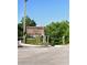 Warner's Bayou Boat Ramp sign amidst lush greenery under a clear blue sky at 1207 65Th Nw St, Bradenton, FL 34209