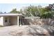 A spacious driveway leads to a wooden privacy fence next to the carport of this lovely home at 1207 65Th Nw St, Bradenton, FL 34209