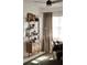 Bright living room featuring a fan, stylish shelves and a comfortable chair, perfect for reading at 1207 65Th Nw St, Bradenton, FL 34209