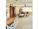 Inviting living room with neutral paint, stylish furniture, ample natural light, and views to kitchen and dining area at 1207 65Th Nw St, Bradenton, FL 34209