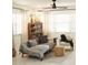 Cozy living room featuring stylish furniture, neutral paint, ceiling fan, and views to front yard through windows at 1207 65Th Nw St, Bradenton, FL 34209