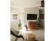 Bright living room featuring neutral decor, a ceiling fan, and a decorative plant, for comfortable everyday living at 1207 65Th Nw St, Bradenton, FL 34209
