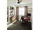 Bright office featuring a fan, stylish shelves and a comfortable desk setup perfect for working from home at 1207 65Th Nw St, Bradenton, FL 34209