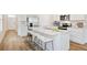 Kitchen features stainless appliances, an island with marble countertop and barstool seating at 12112 Wild Blue Pl, Parrish, FL 34219