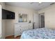 Bedroom view showcasing a large dresser with wall mounted TV and ensuite access at 123 52Nd St # B, Bradenton Beach, FL 34217