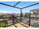This is a wooden deck with black rails that has views of the community around the home at 123 52Nd St # B, Bradenton Beach, FL 34217