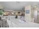 Inviting dining area with a white table, seashell decor, and views into the living room and kitchen at 123 52Nd St # B, Bradenton Beach, FL 34217