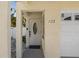 A closer view of the front door and address with stylish details at 123 52Nd St # B, Bradenton Beach, FL 34217