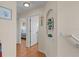 Hallway leading to bedrooms with light wood flooring and neutral walls at 123 52Nd St # B, Bradenton Beach, FL 34217