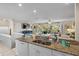 Spacious kitchen with granite countertops and an open floor plan, flowing into the living area at 123 52Nd St # B, Bradenton Beach, FL 34217