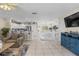 Spacious living room flows into the kitchen, offering ample seating and tile flooring throughout at 123 52Nd St # B, Bradenton Beach, FL 34217