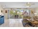 Bright living room with comfortable seating, decor, and access to a screened porch at 123 52Nd St # B, Bradenton Beach, FL 34217
