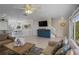 Open-concept living area features tile floors, comfortable seating, and easy access to the kitchen and dining at 123 52Nd St # B, Bradenton Beach, FL 34217