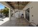 Covered outdoor patio with bar, grill, and shower for seamless indoor-outdoor living at 123 52Nd St # B, Bradenton Beach, FL 34217
