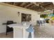 Outdoor covered patio featuring a wet bar and grill setup, perfect for summer cookouts and gatherings at 123 52Nd St # B, Bradenton Beach, FL 34217