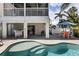 Outdoor space featuring a pool, spa, outdoor dining, bar seating and covered patio for easy entertaining at 123 52Nd St # B, Bradenton Beach, FL 34217