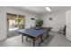 Recreation room with ping pong table, sliding doors, and an outdoor patio at 123 52Nd St # B, Bradenton Beach, FL 34217
