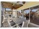 Relax on this screened porch with an outdoor table and chairs with a tropical view at 123 52Nd St # B, Bradenton Beach, FL 34217