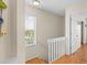 Bright stairwell with wood floors, a window and neutral walls at 123 52Nd St # B, Bradenton Beach, FL 34217
