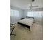 Bright bedroom with neutral carpet, fan, and lots of natural light through dual windows at 134 Gulfview Rd, Punta Gorda, FL 33950
