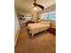 Cozy bedroom with neutral walls, carpet floors, dresser, and natural light from window at 134 Gulfview Rd, Punta Gorda, FL 33950