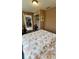 Cozy bedroom featuring a ceiling fan, closet, and a doorway to another room at 134 Gulfview Rd, Punta Gorda, FL 33950