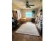 Bonus room with lots of storage and natural light, has a ceiling fan and wood-look floors at 134 Gulfview Rd, Punta Gorda, FL 33950