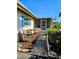Inviting screened front porch with seating provides a relaxing spot at 134 Gulfview Rd, Punta Gorda, FL 33950