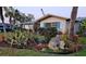 Beautiful Florida home enhanced by gorgeous, tropical landscaping at 134 Gulfview Rd, Punta Gorda, FL 33950