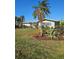 Lush landscaping with palms enhance this home's curb appeal at 134 Gulfview Rd, Punta Gorda, FL 33950